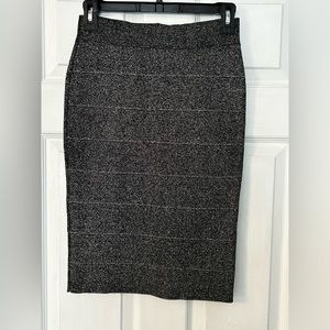 BCBG MAXAZRIA size small, black/silver bandage skirt. Below knee style.